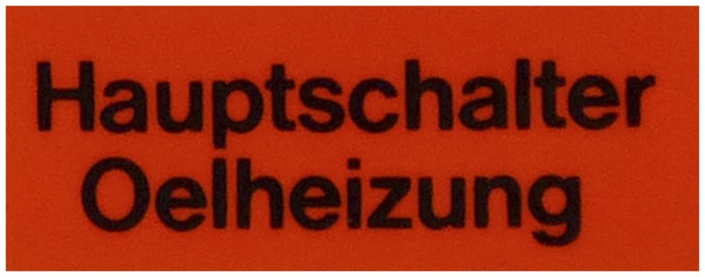 Klebeschild (Hauptschalter Ölheizung)